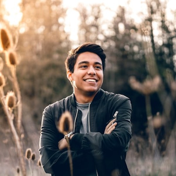 Portrait of Tyler Brooks, young male diagnostics technician holding a wrench